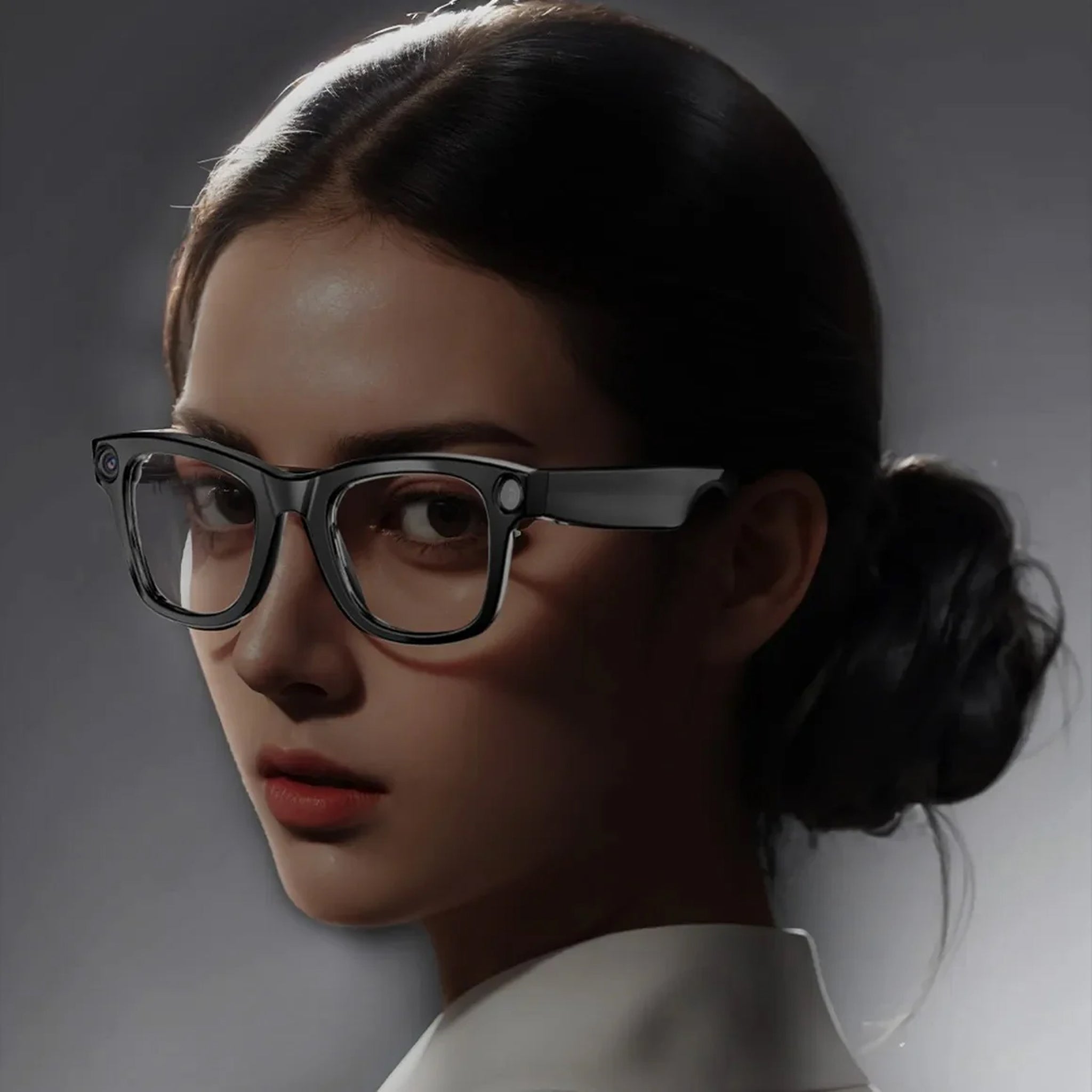 Person wearing glasses with a dark background