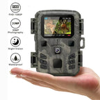 Camouflage trail camera held in a hand with features listed on a white background