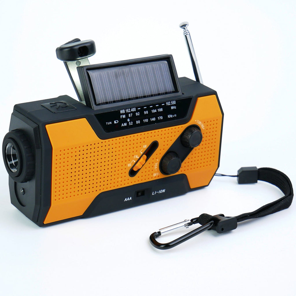 Orange and black portable radio with solar panel on a white background