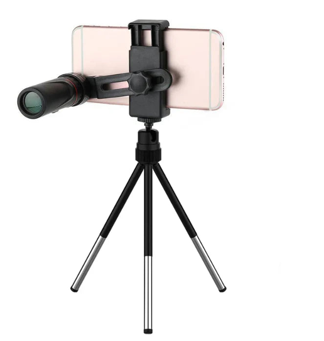Phone with a telescope attachment on a tripod against a white background