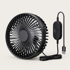 Black portable fan with USB cable on a light beige background