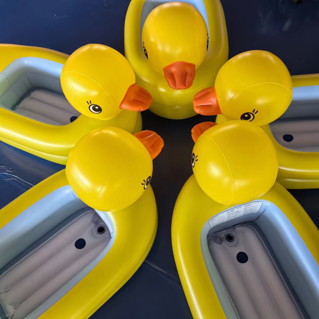 Yellow inflatable ducks with orange beaks on a dark blue background