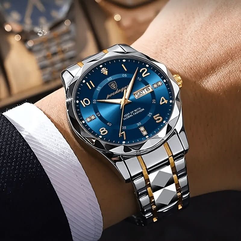 Luxury watch with blue dial and silver and gold bracelet on a wrist.