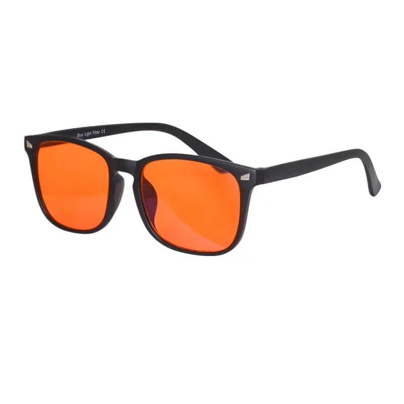 Sunglasses with black frame and orange lenses on a white background