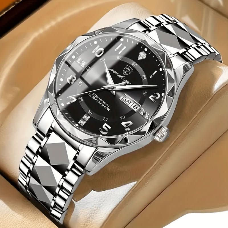 Silver wristwatch with black dial on a beige surface
