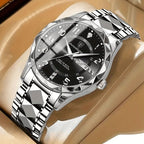 Silver wristwatch with black dial on a beige surface
