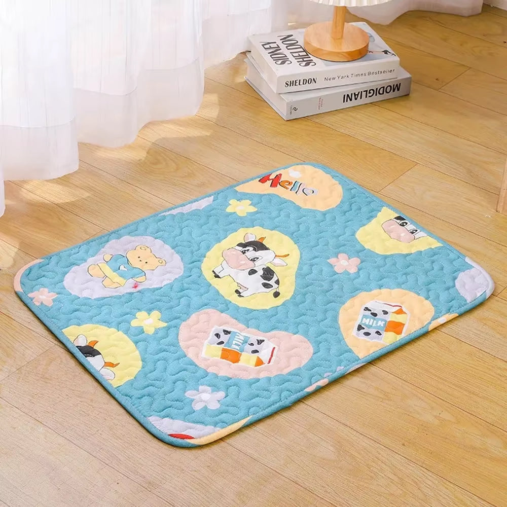 Children's play mat with cartoon designs on a wooden floor