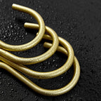 Gold metal loops on a black textured background