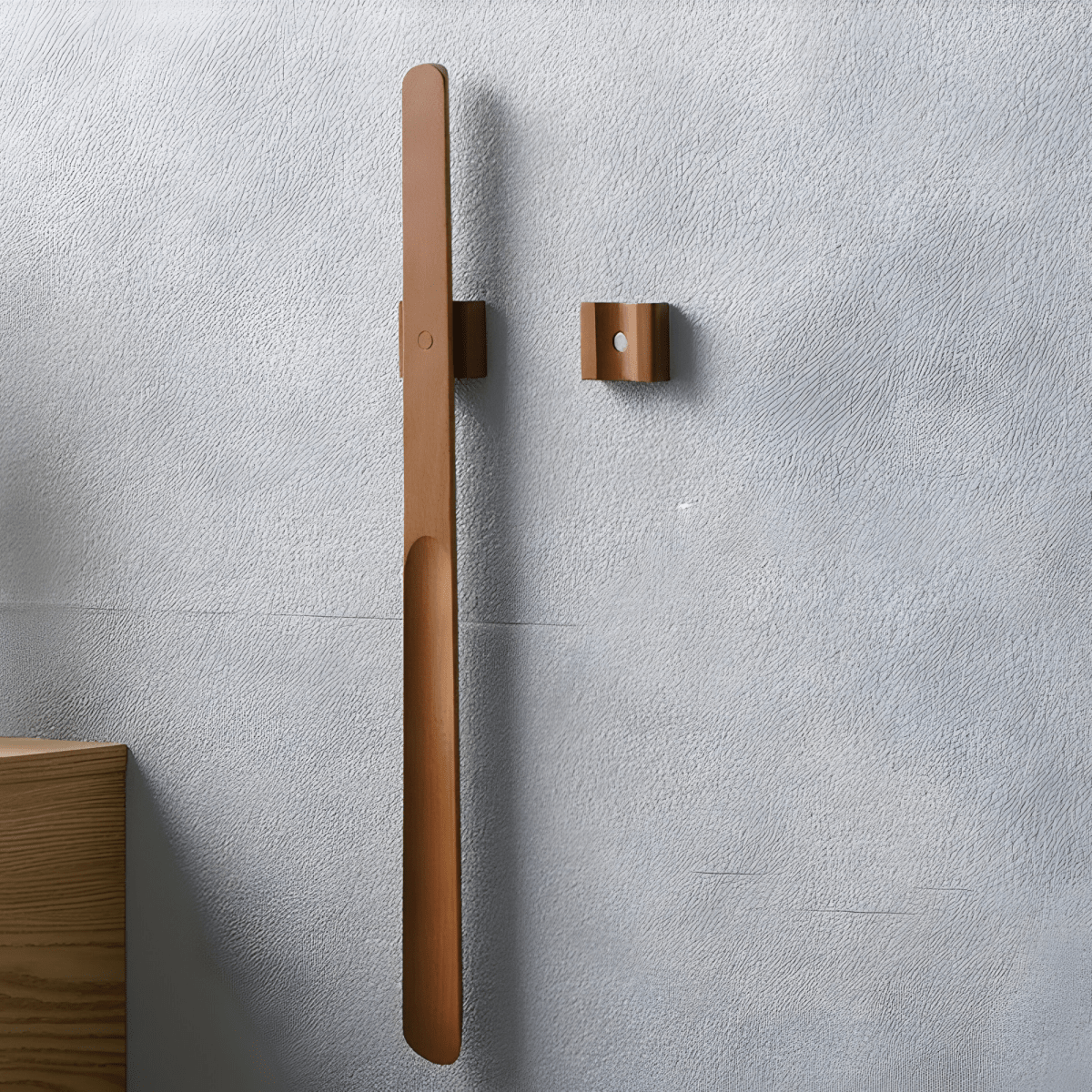 Brown door handle and lock on a gray wall