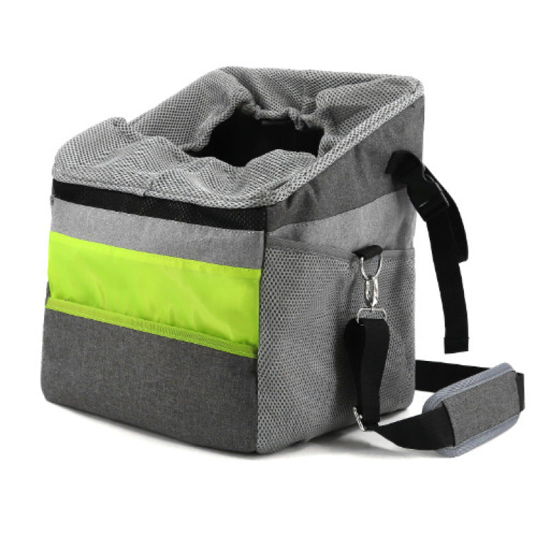 Gray and green pet carrier with straps on a white background