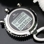 Digital stopwatch with a black face and silver casing on a dark background