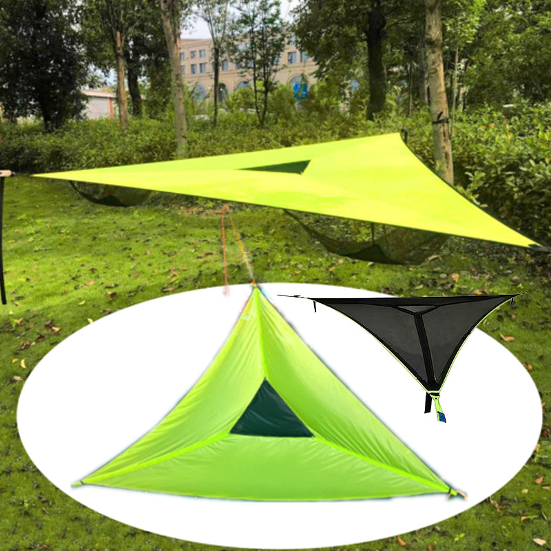 Two camping tents, one green and one black, on a grassy background with trees.