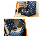 Navy blue car seat cover with white star pattern on a car seat.
