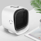 White portable air conditioner on a light gray surface with a plant in the background