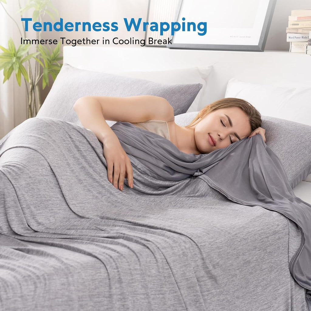 Woman lying on a bed under a gray cooling break blanket with text 'Tenderness Wrapping' and 'Immerse Together in Cooling Break'.