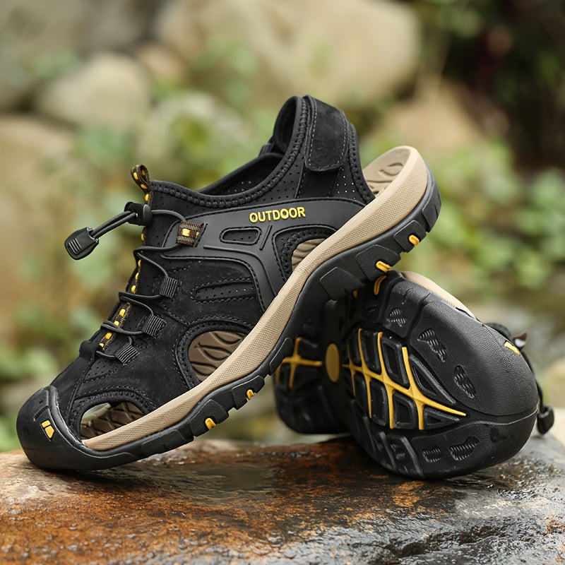 Black and beige outdoor shoes with 'Outdoor' label on a natural background