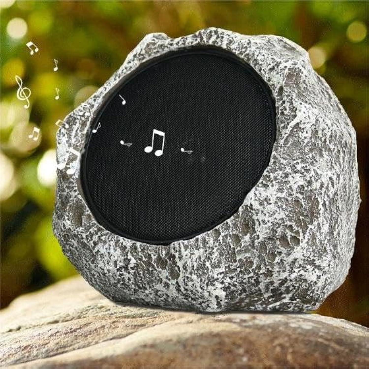 Rustic stone-style Bluetooth speaker with a black grille on a natural background