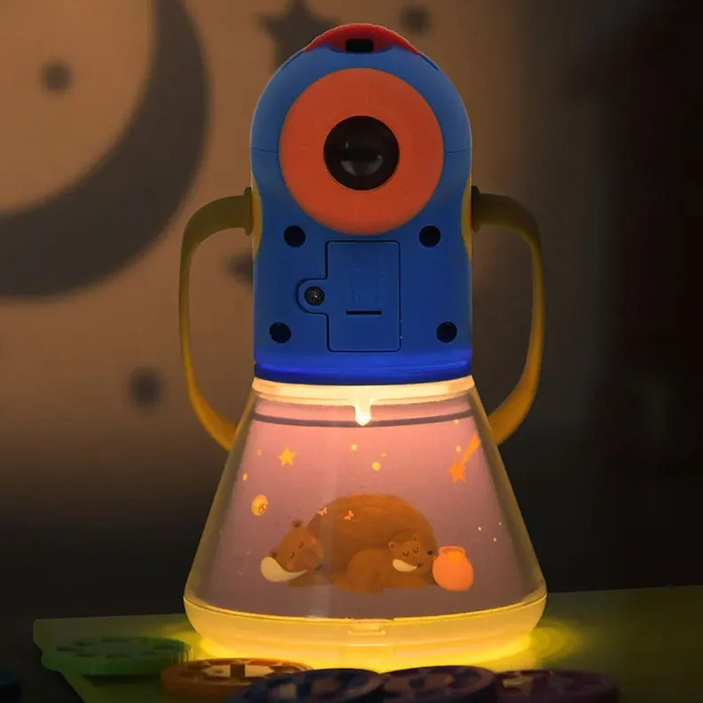 Children's robot toy with a light-up display featuring a bear and fish in a dark setting