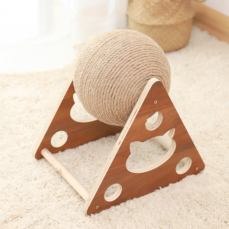 Wooden cat toy with a ball on a white carpet