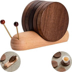 Wooden coaster set with holder shaped like a snail on a white background