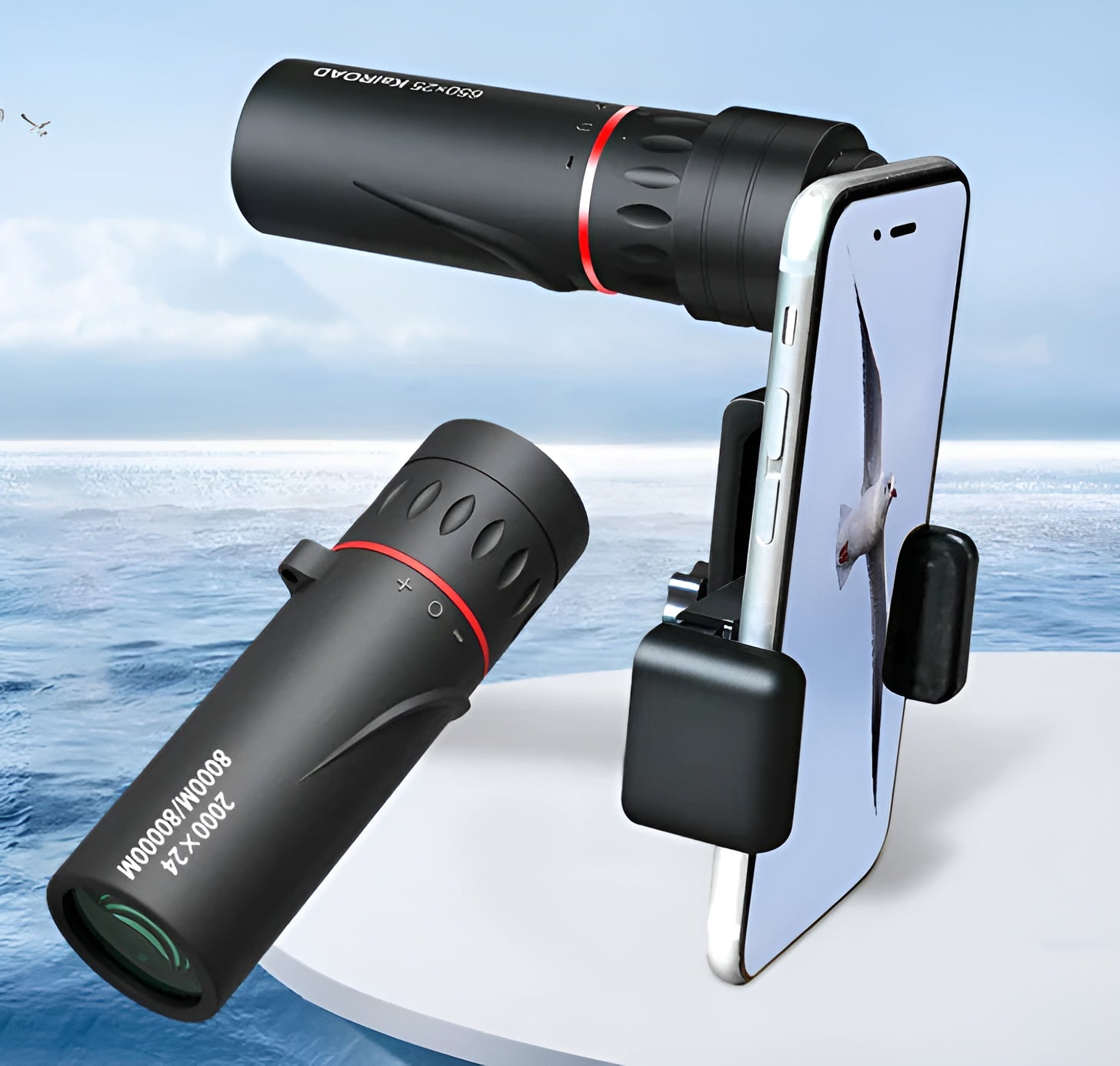 Two black monoculars with smartphone holder against a scenic background