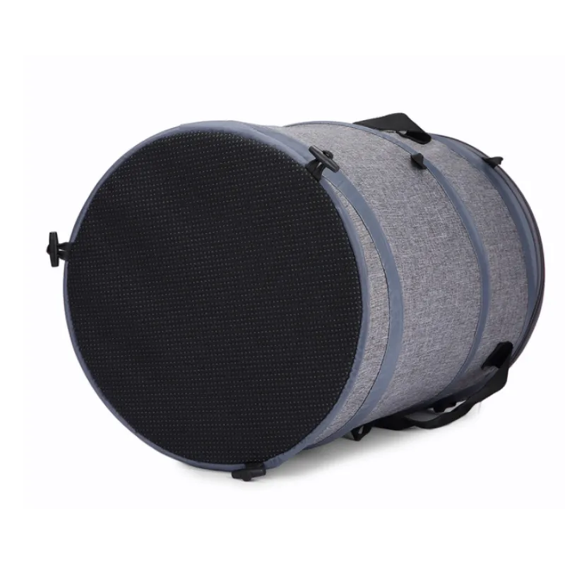Gray pet carrier with black mesh door on a white background