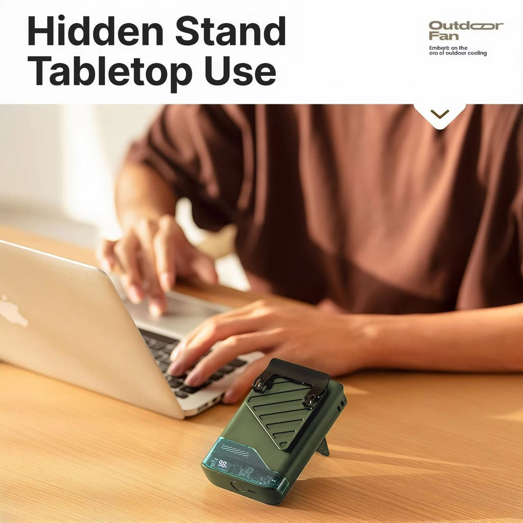 Person using a laptop with a hidden stand on a desk, featuring Outclear Fan branding.