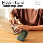 Person using a laptop with a hidden stand on a desk, featuring Outclear Fan branding.