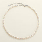 Pearl necklace on a beige background