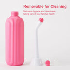 Pink cleaning bottle with detachable parts on a white background