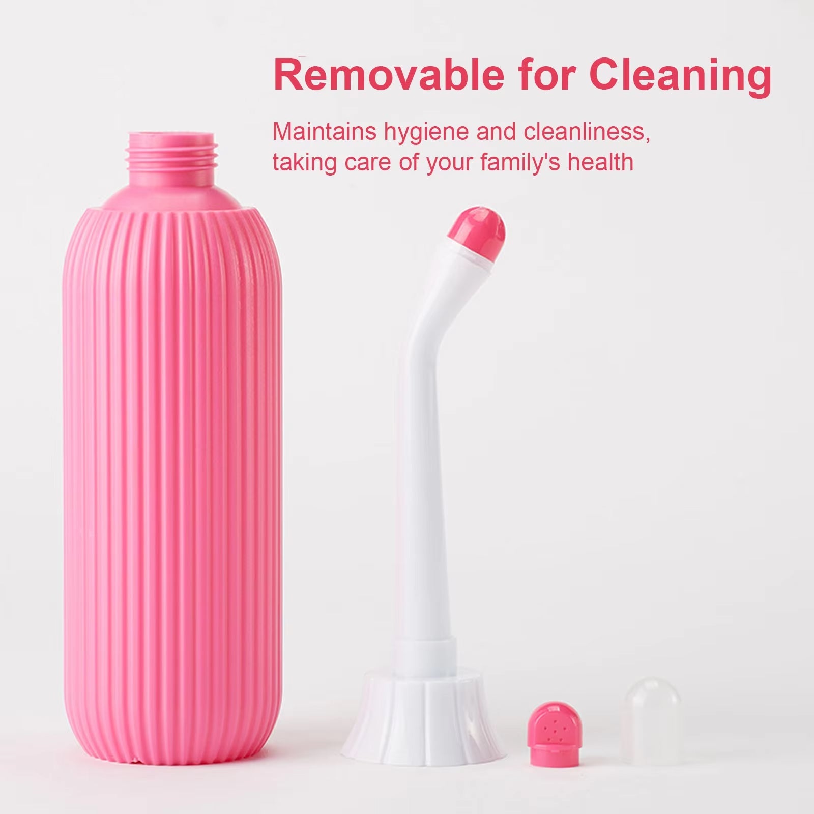Pink cleaning bottle with detachable parts on a white background