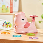 Pink toy duck with a spinning top on a wooden surface