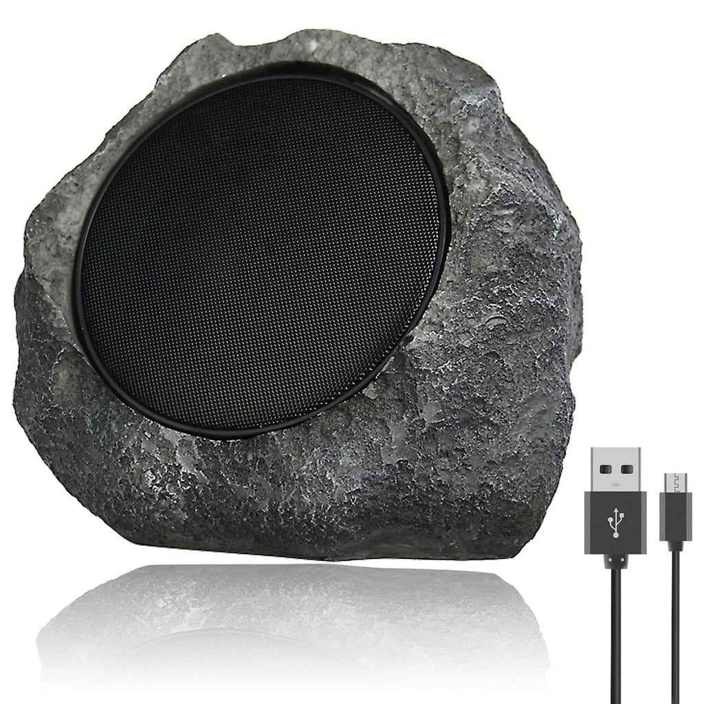 Rustic stone speaker with USB cable on a white background