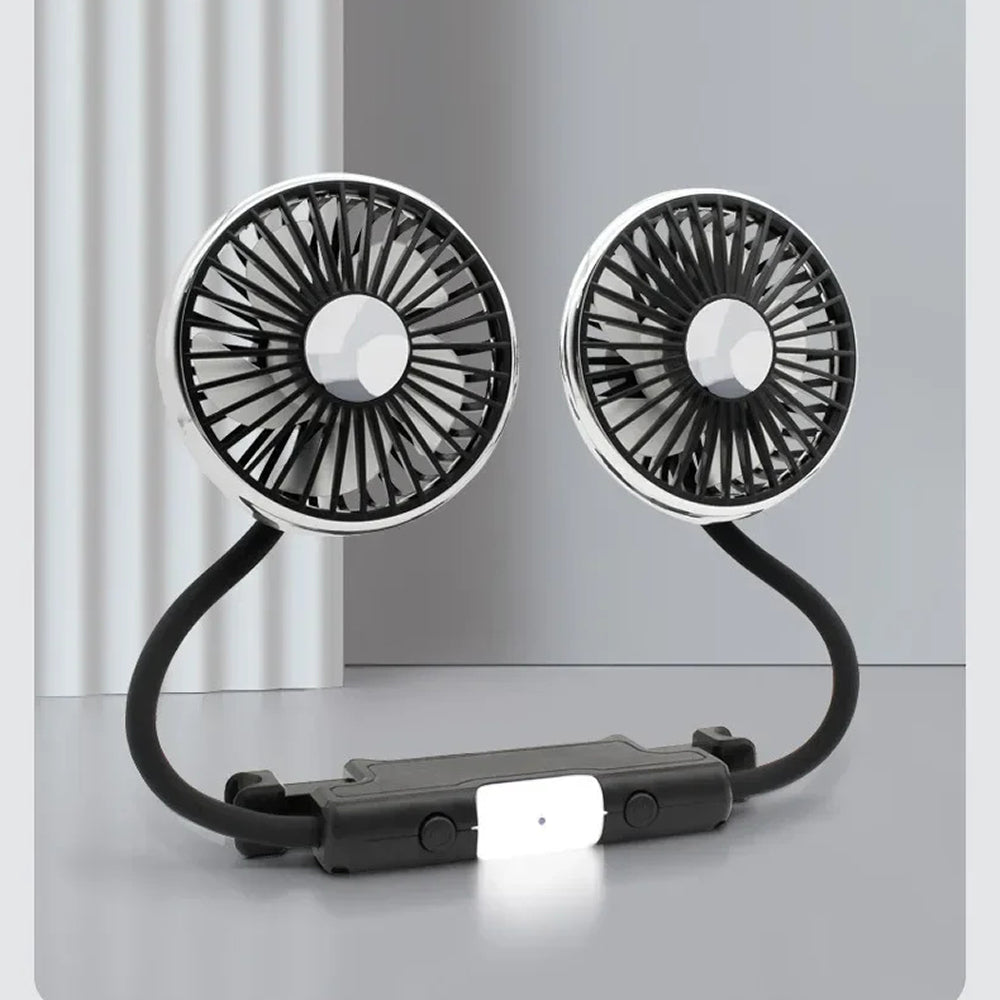 Portable dual-rotor fan on a gray surface with a light gray background