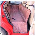 Pet car seat cover with a leopard print pattern installed in a vehicle.