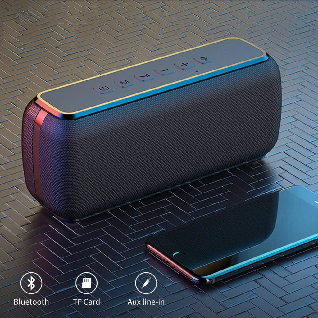 Black portable speaker with smartphone on a textured surface