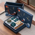 Tea set with decorative packaging on a wooden surface