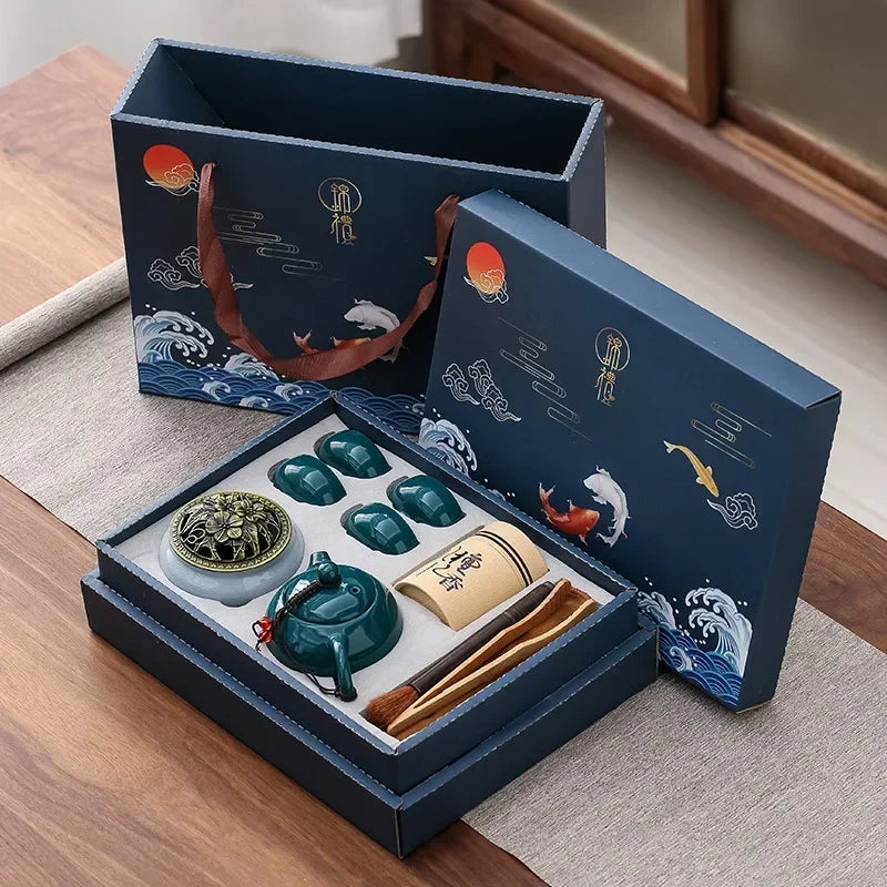 Tea set with decorative packaging on a wooden surface