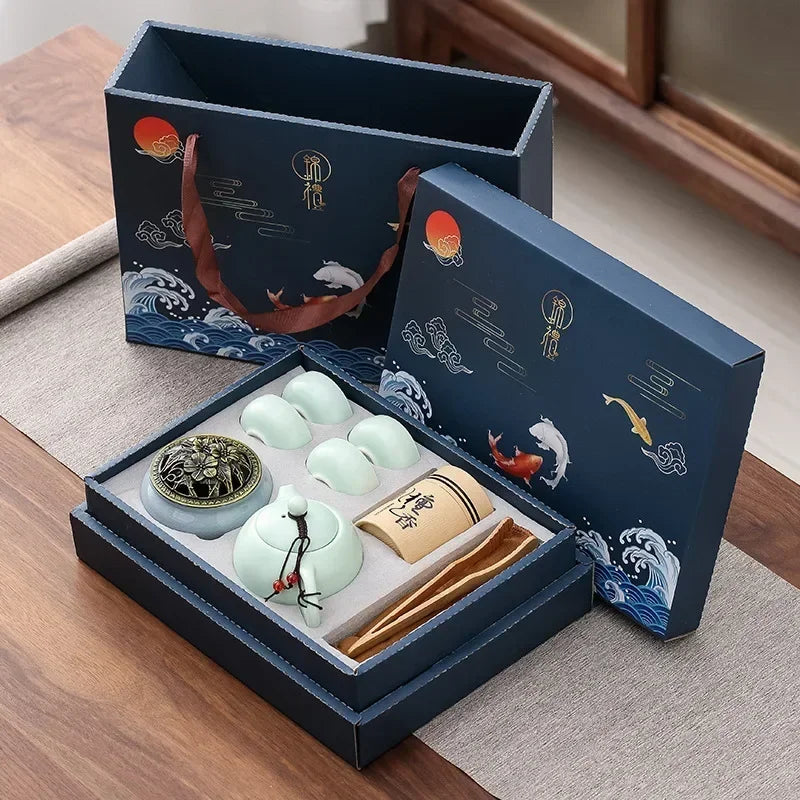 Tea set with decorative packaging on a wooden surface