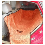 Car seat cover with a floral pattern inside a red car.
