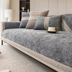 Gray sofa with patterned cushions in a living room setting