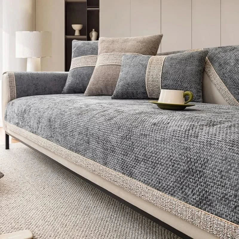Gray sofa with patterned cushions in a living room setting
