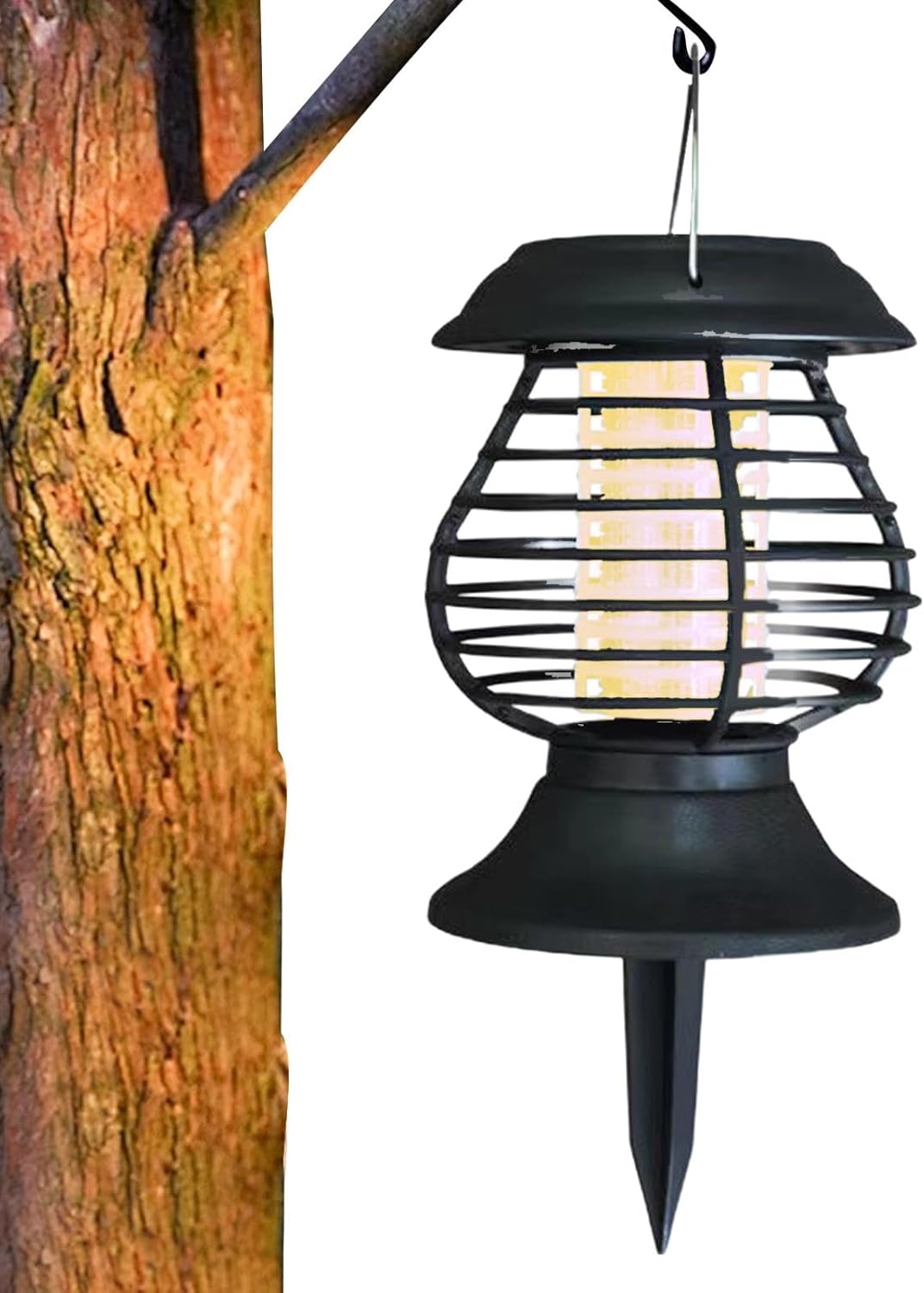 Black outdoor hanging light fixture attached to a tree