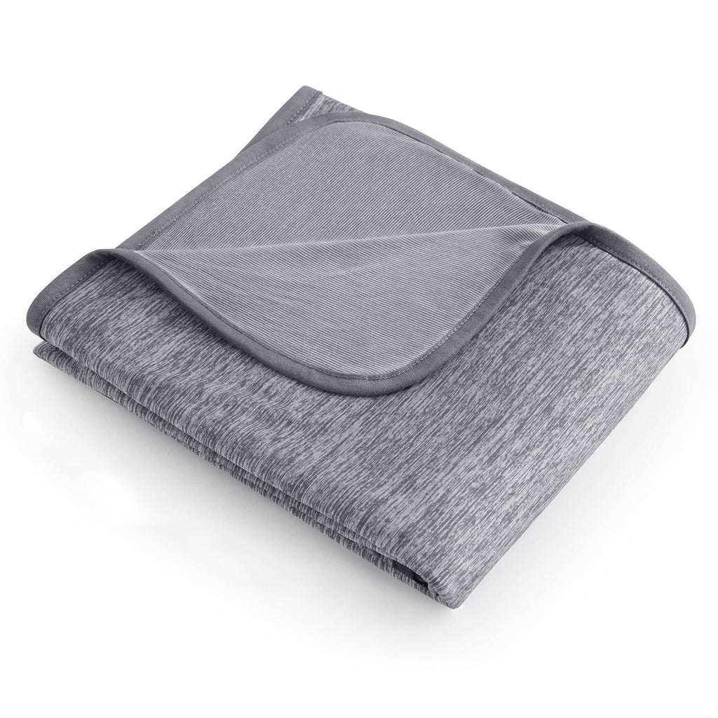 Gray textured blanket folded on a white background