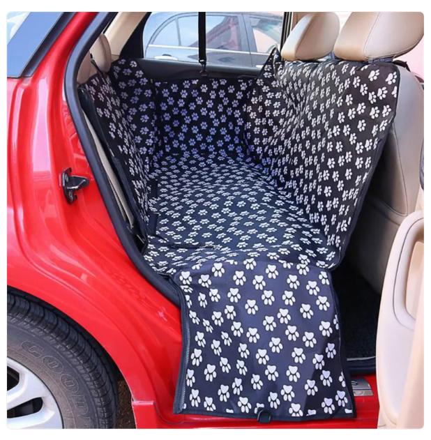 Car seat cover with paw pattern in a car interior
