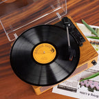 Wooden record player with a vinyl record on a wooden surface