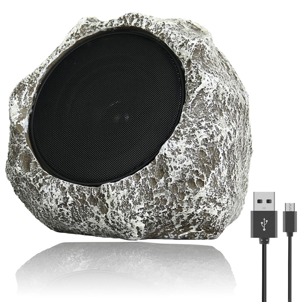 Rustic stone-style outdoor speaker with USB cable on a white background