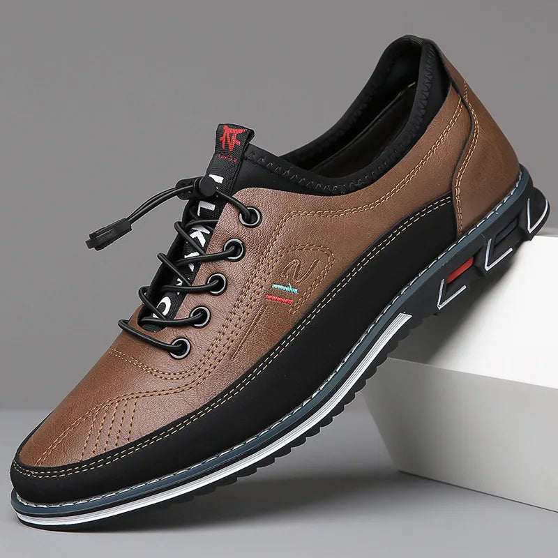 Brown leather shoe with black accents on a gray background