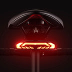 Bicycle tail light with red and orange LED on a black background