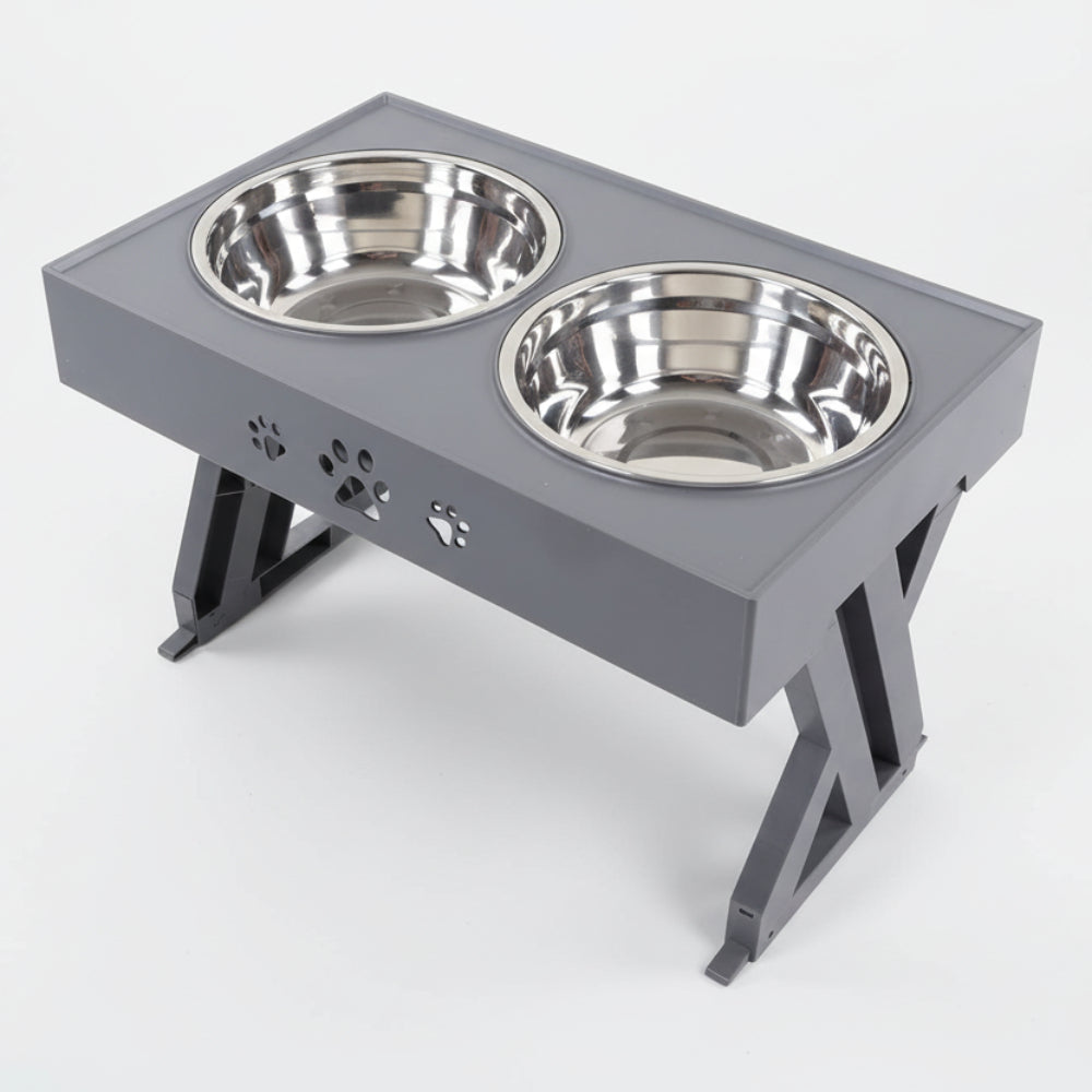 Pet feeding station with two stainless steel bowls on a gray stand.